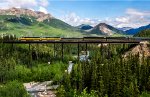 Northbound passenger train across Riley's Creek Trestle in Denali National Park